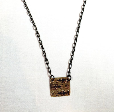 C. Tres Cocodrilo Engraved Brass Necklace